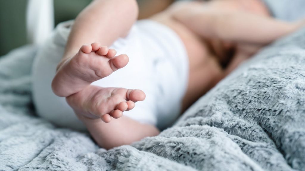 pexels photo 31577181 Close-up of baby feet on a plush blanket, illustrating comfort and innocence.